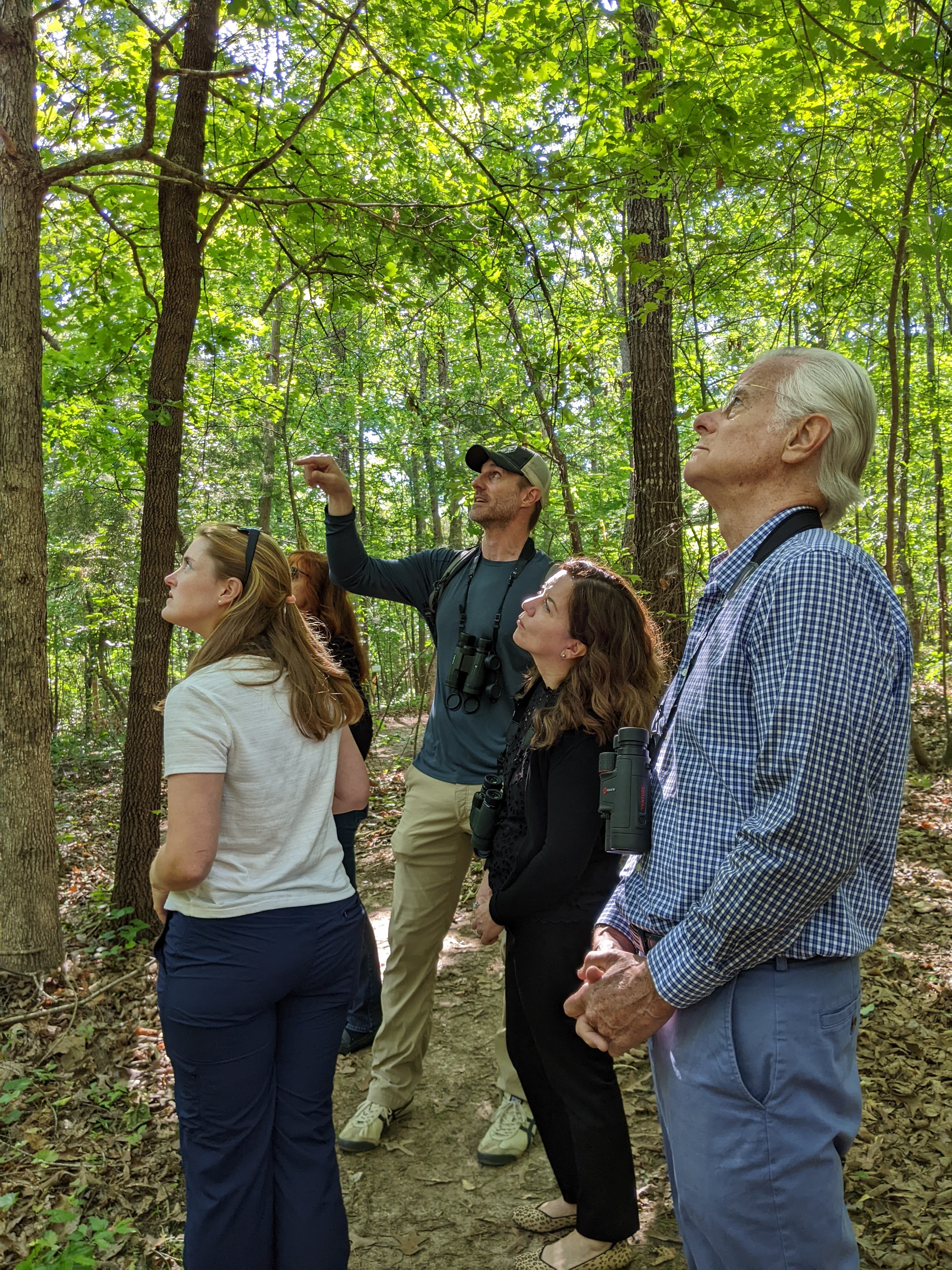 Jay Keck (in the khaki pants) leading a group of birders on Ballentine's Nature Walk