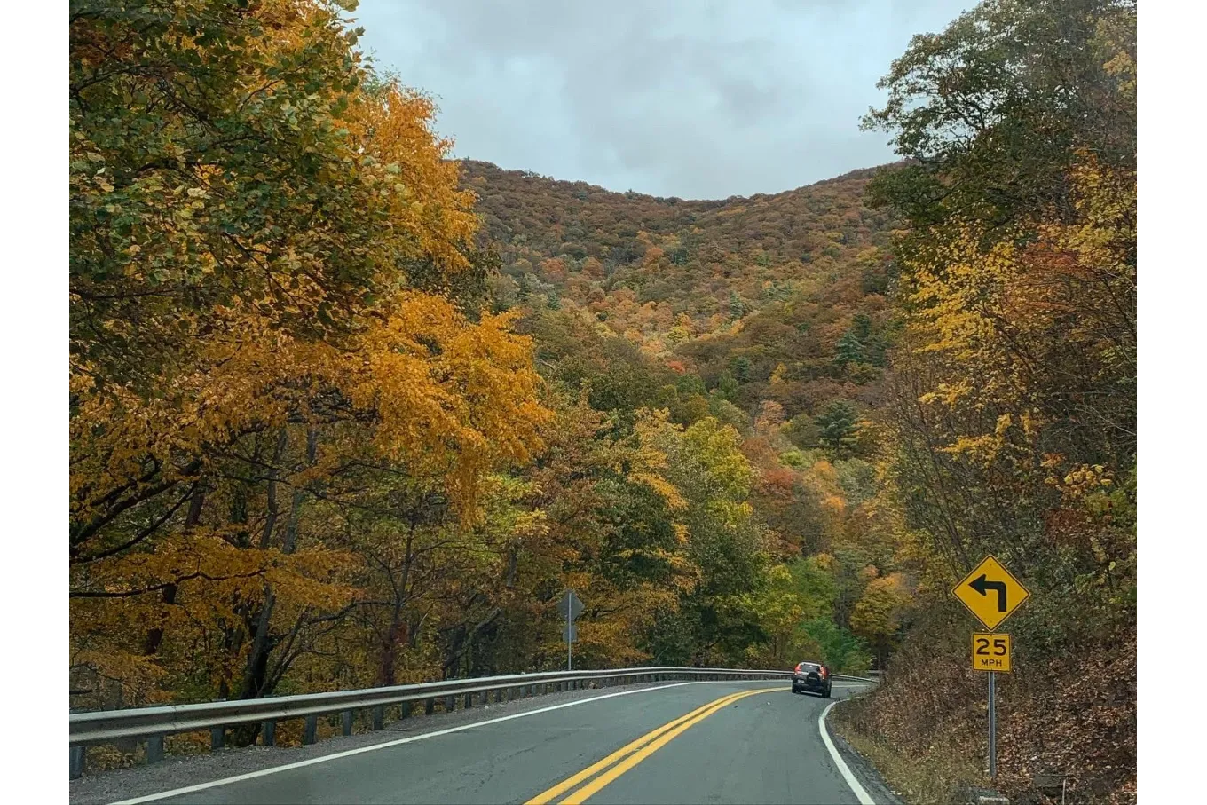 Photo of a road in West Virginia mountains during fall.