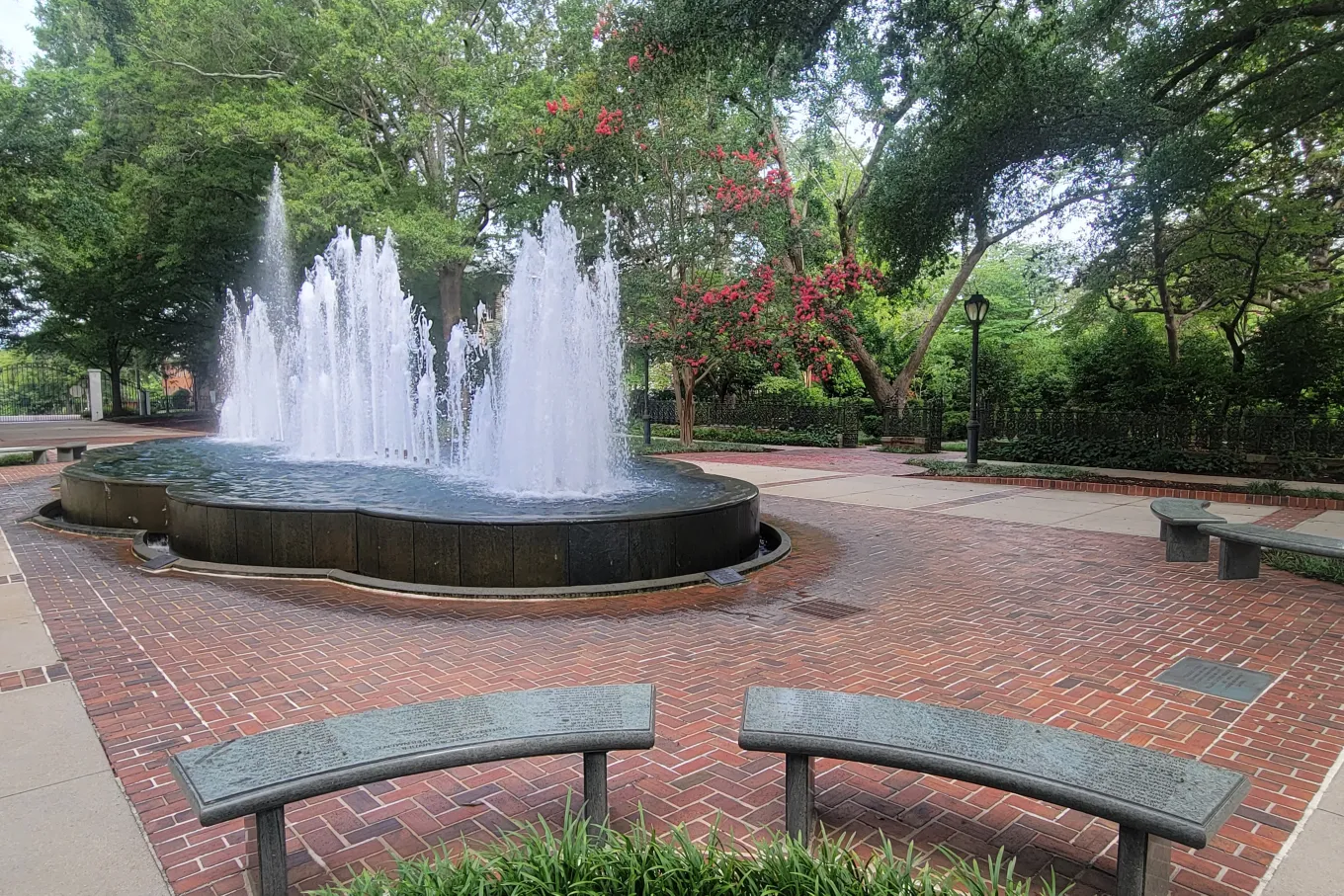 fountain surrounded by brick