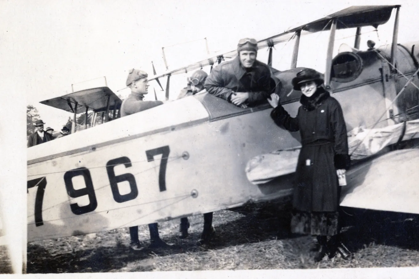 Air pilot Harley Pope with woman in front of airplane