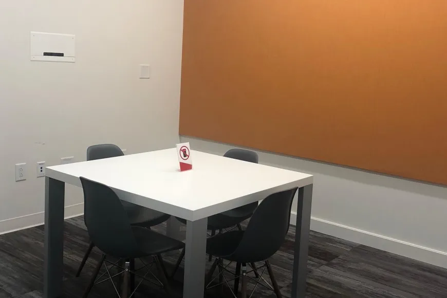 Small study room with four chairs and one table