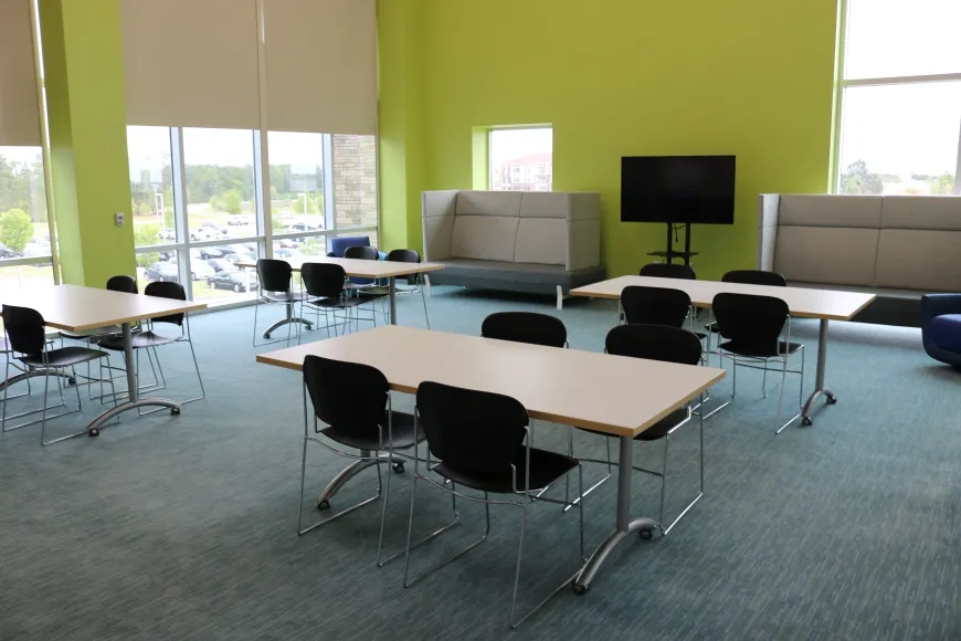 Large meeting room with tables and chairs