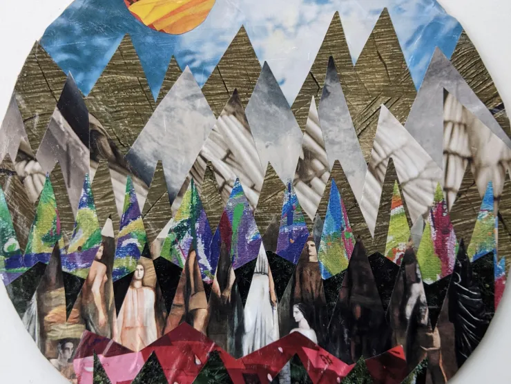 Photo: collage art made with images from magazine pages glued to cardboard. It is very spiky and reminiscent of abstract mountains under a blue sky.