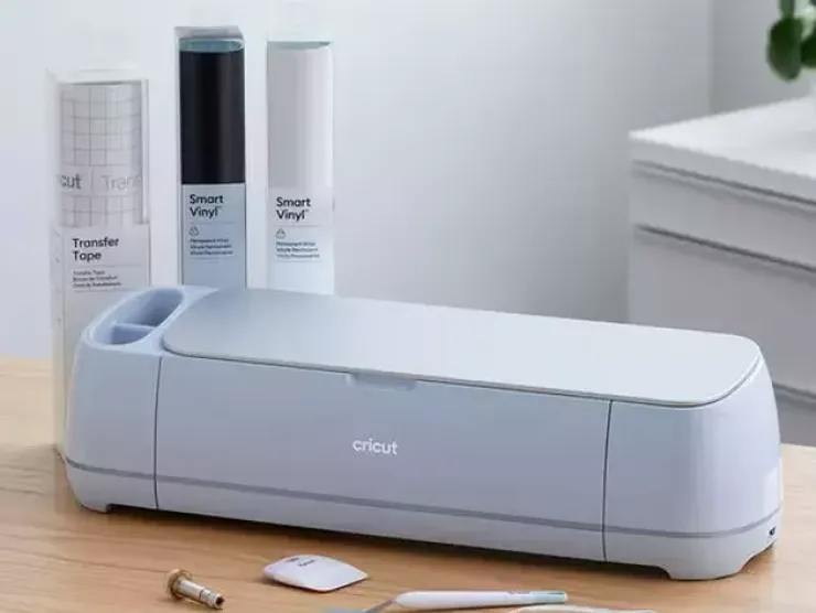 a cricut maker 3 with tools and basic materials