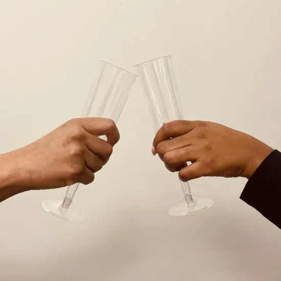 toast with two hands, champagne glass