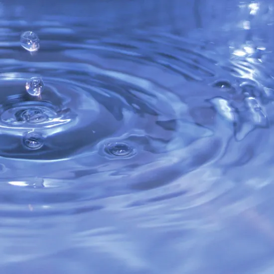 droplet of water in large body of water