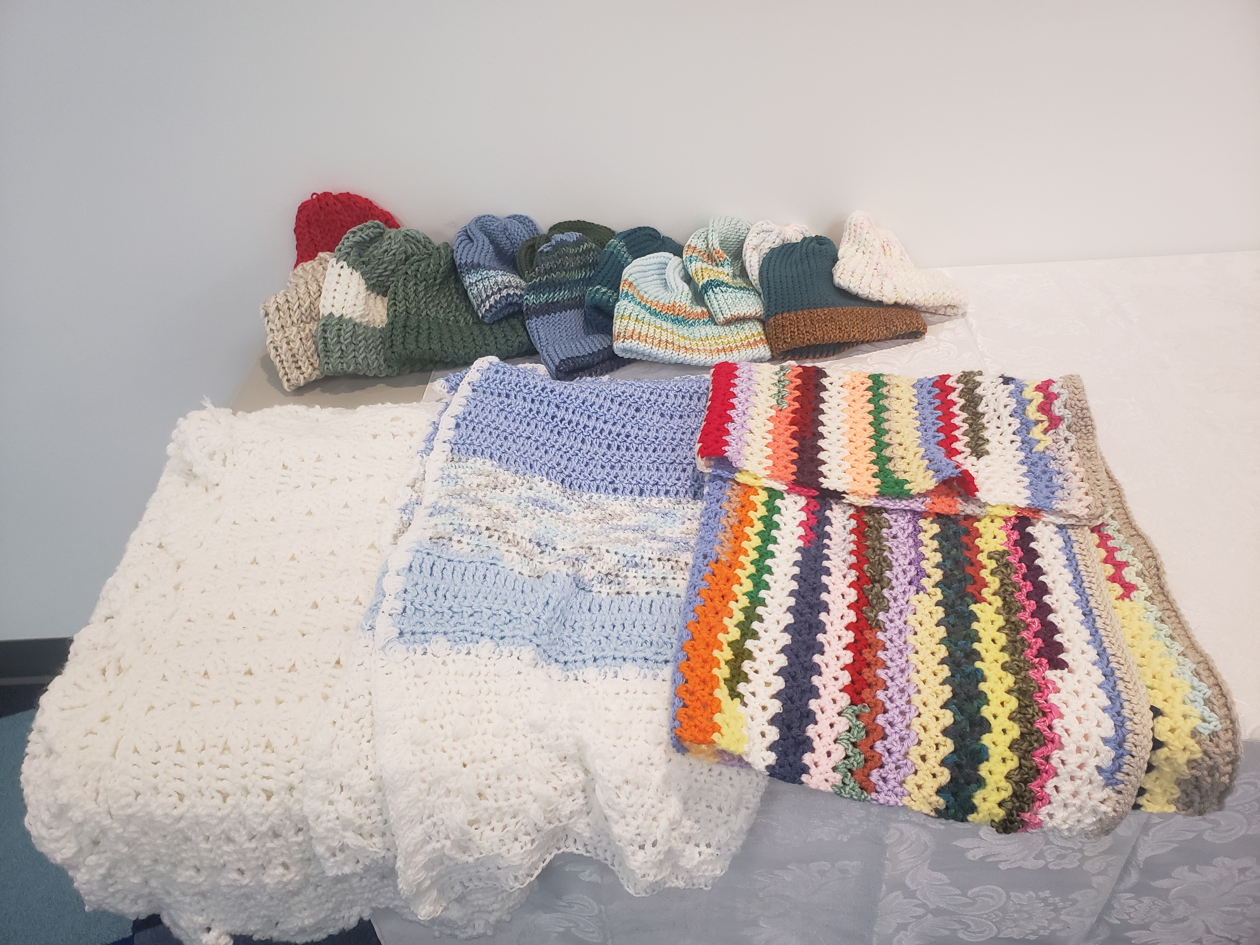 Crocheted and knitted hats and blankets