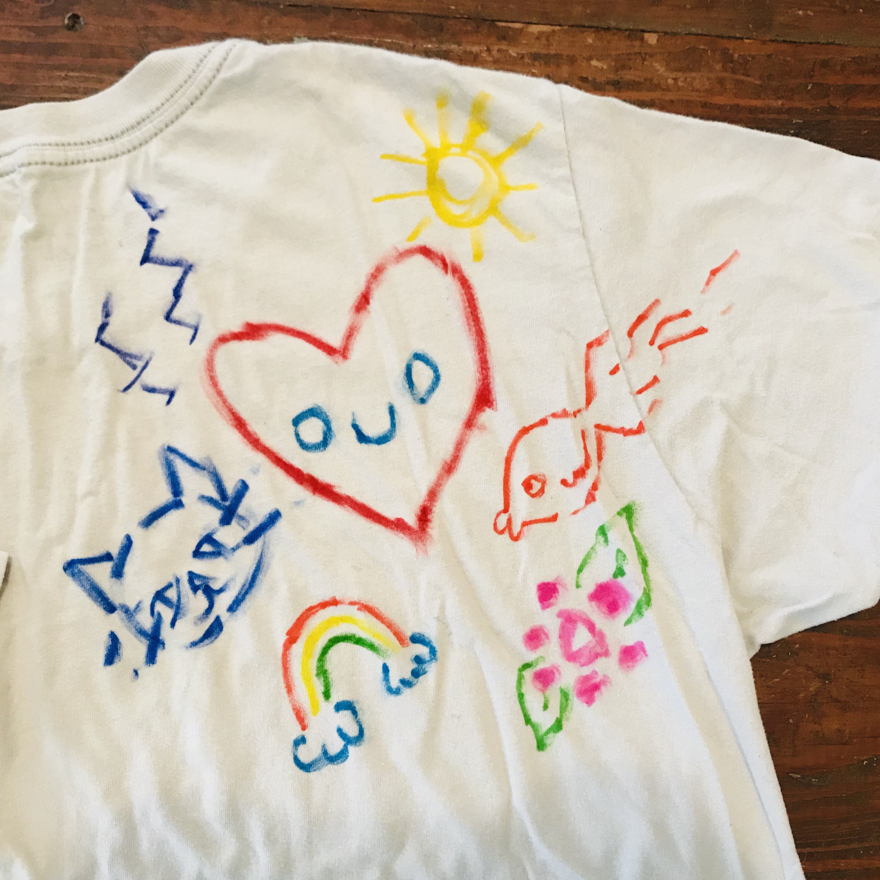 White t-shirt with colorful designs