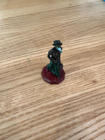 Painted Miniature figurine wearing a "plague doctor" mask and top hat
