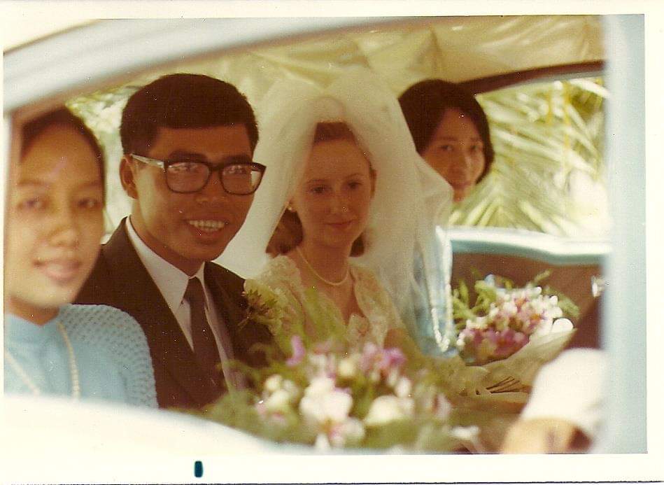 bride and groom on their wedding day, with bridesmaids