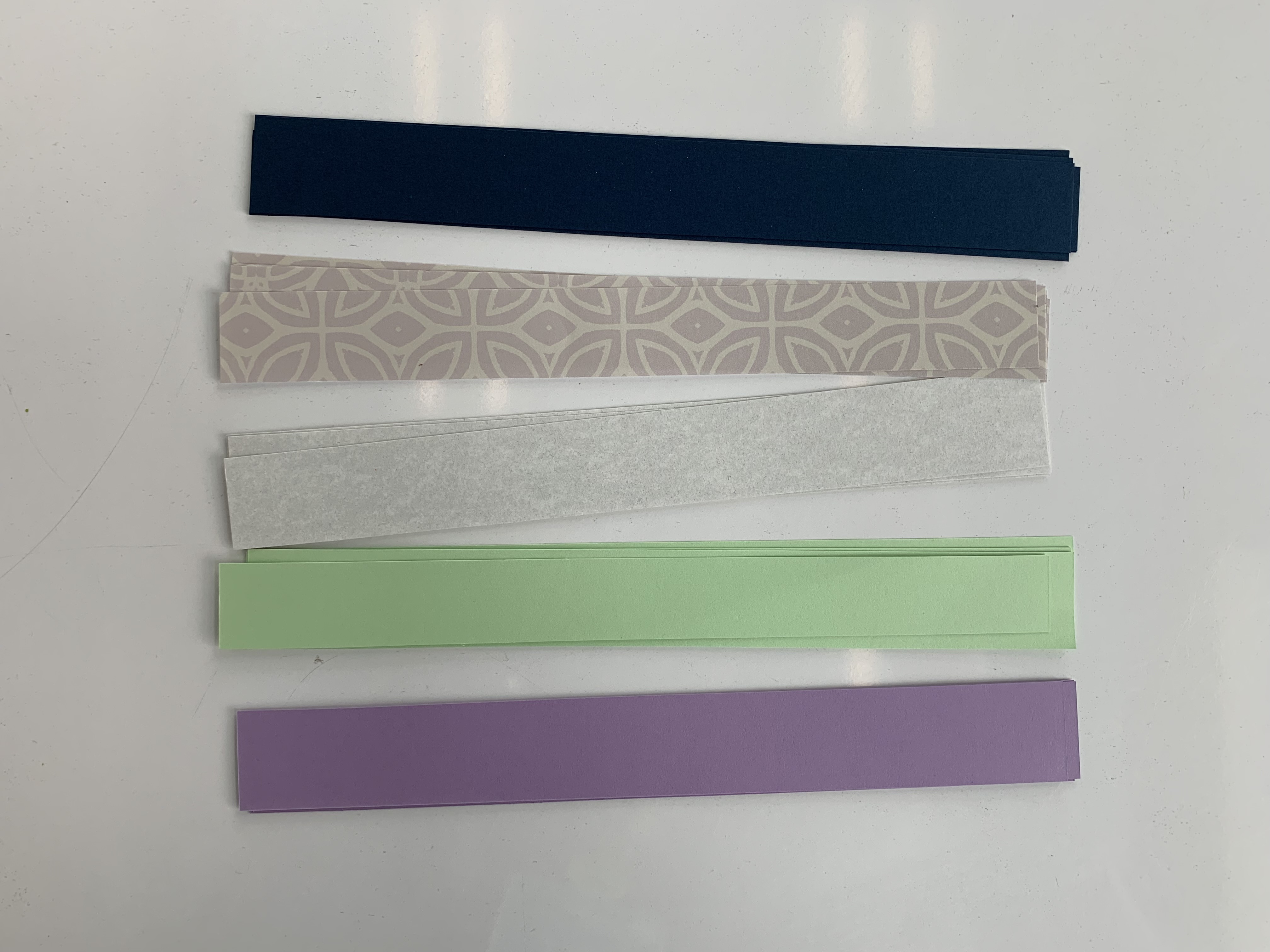 Photo of paper strips in different colors and patterns