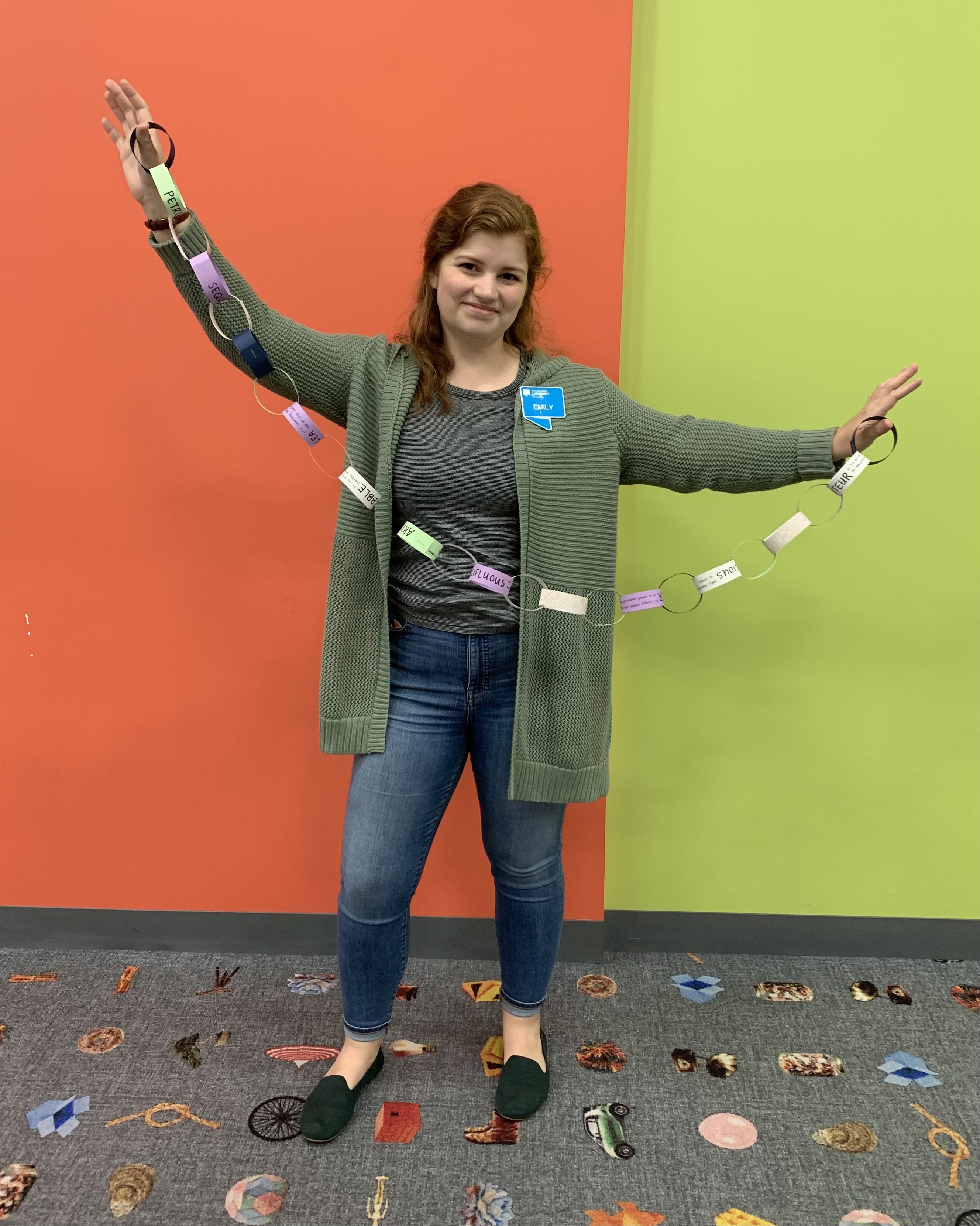 Photo of library staff member holding paper chain