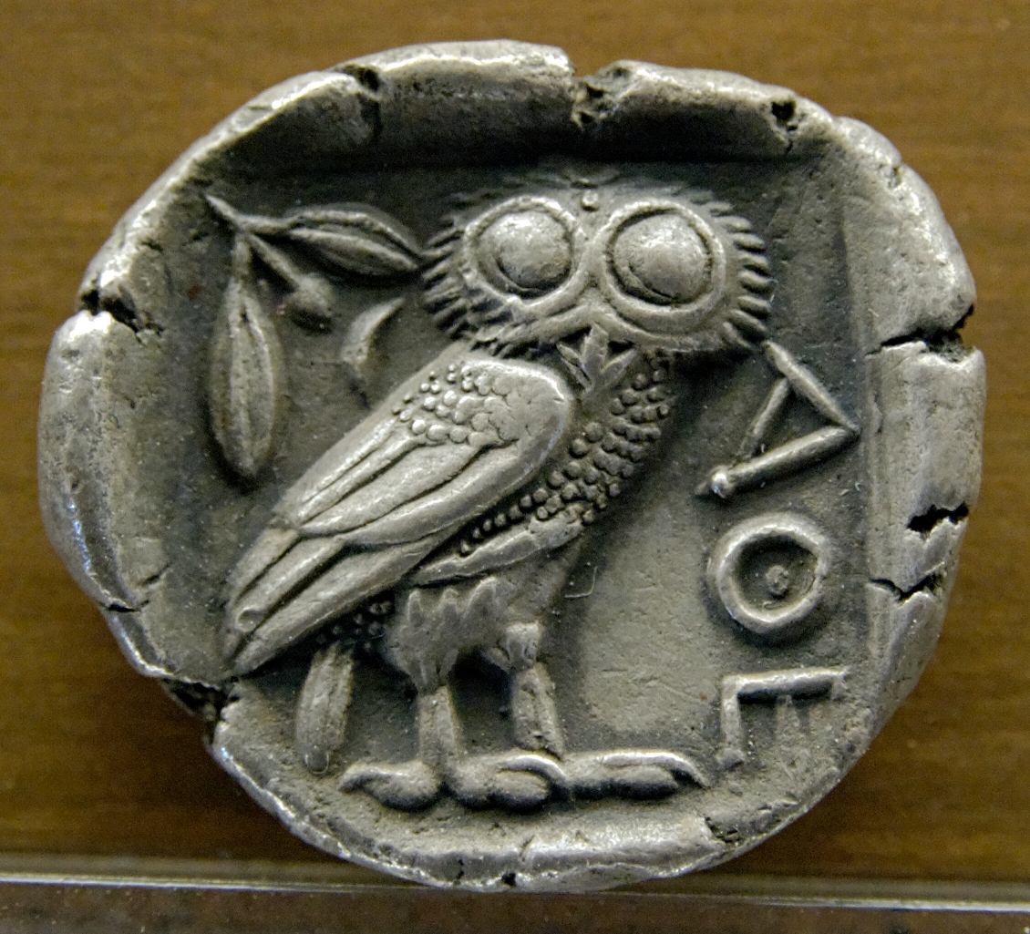 The Owl of Athena depicted on the back of a silver tetradrachm coin from Athens, Greece (ca. 480–420 BC) 