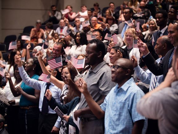 WASHINGTON - Director of U.S. Citizenship and Immigration Services León Rodríguez and Chief of Staff at the Department of Homeland Security Paul Rosen participate in a Naturalization Ceremony on World Refugee Day at the Holocaust Memorial Museum in Washington, D.C., June 20, 2016. During the event, 37 people became Naturalized U.S. Citizens. Official USCIS photo by David Jensen.