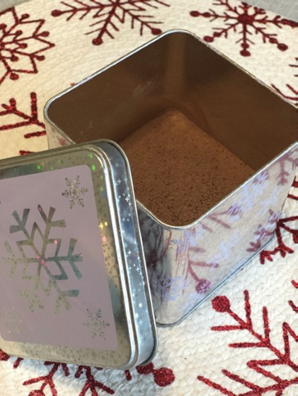 cocoa mix in a snowflake patterned tin