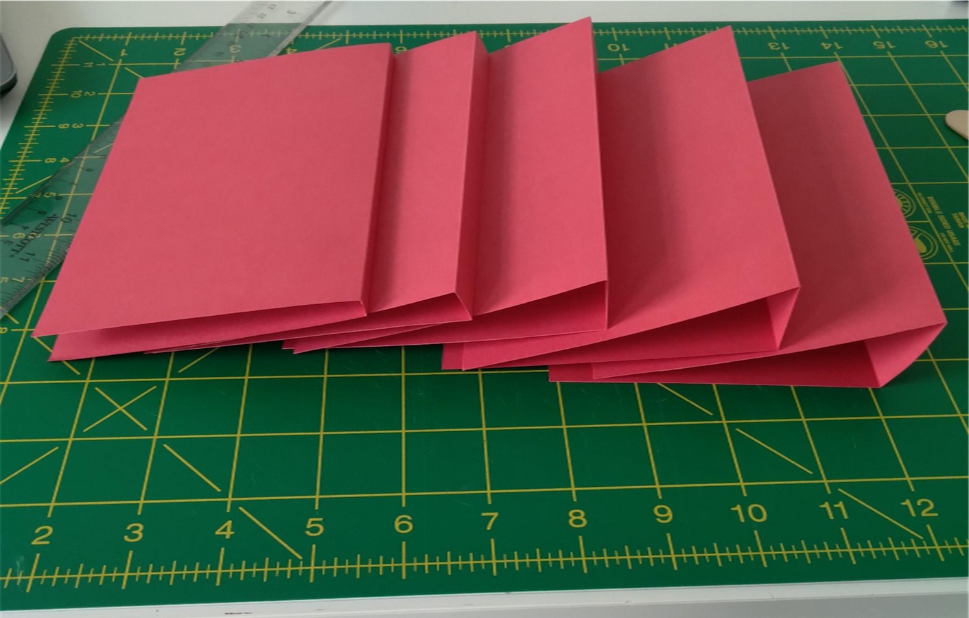 Five sheets of folded cardstock