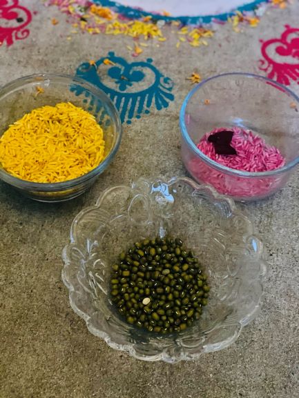 Colored rice and lentils used for making Rangoli designs