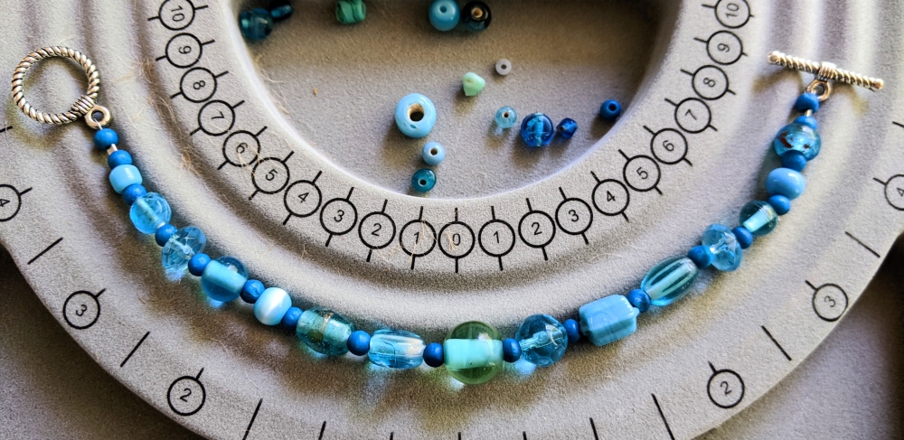 a bracelet made of various blue beads