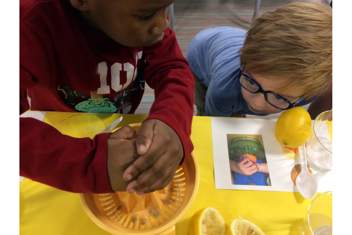 Children learn to squeeze lemons in the Education Studio