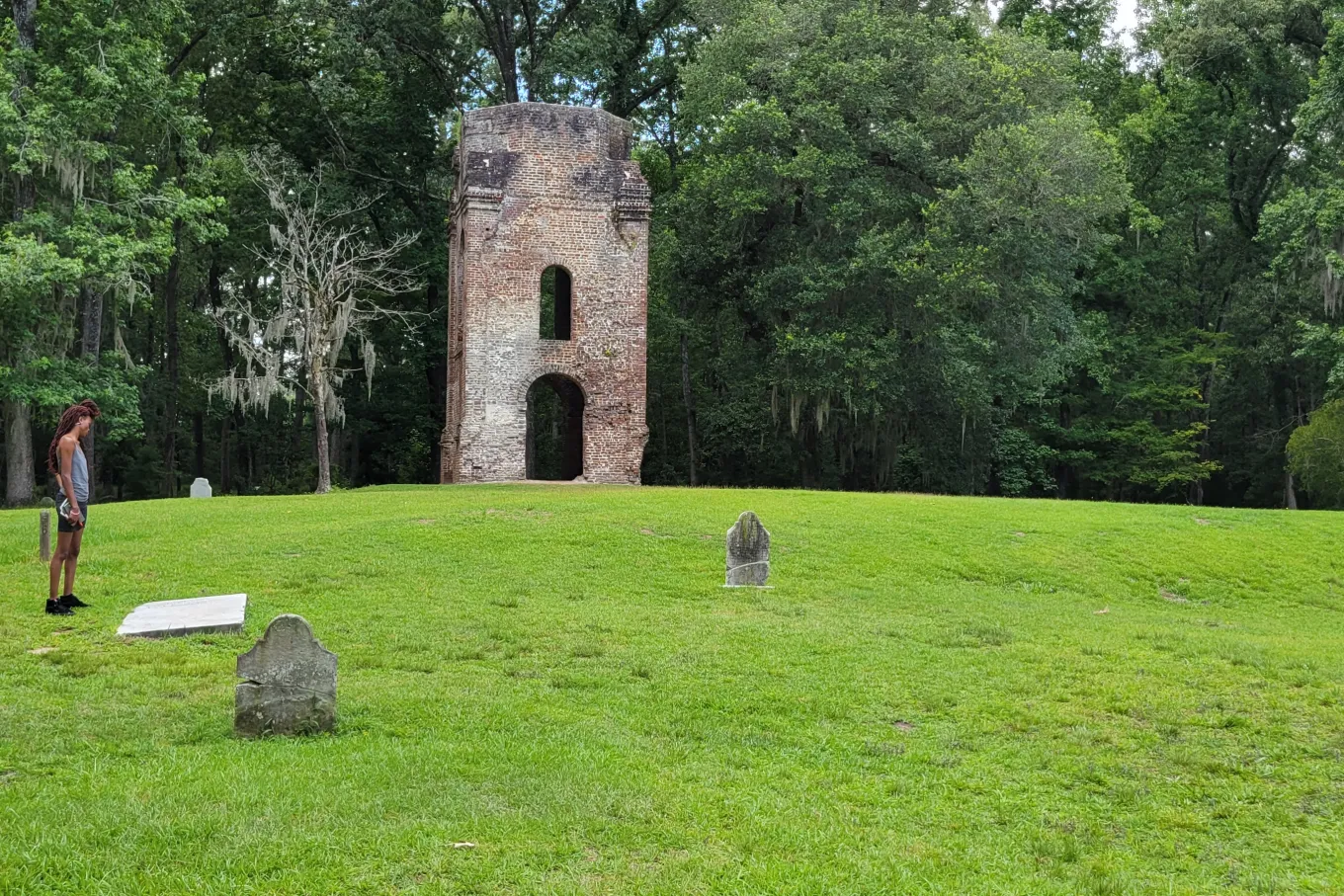 woman looking at historical ruins