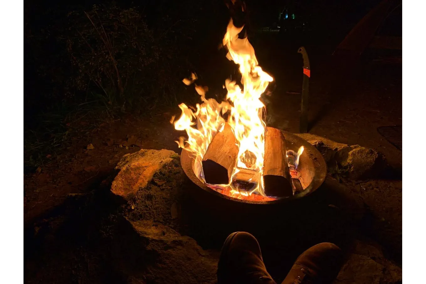 Photo of a campfire at night.