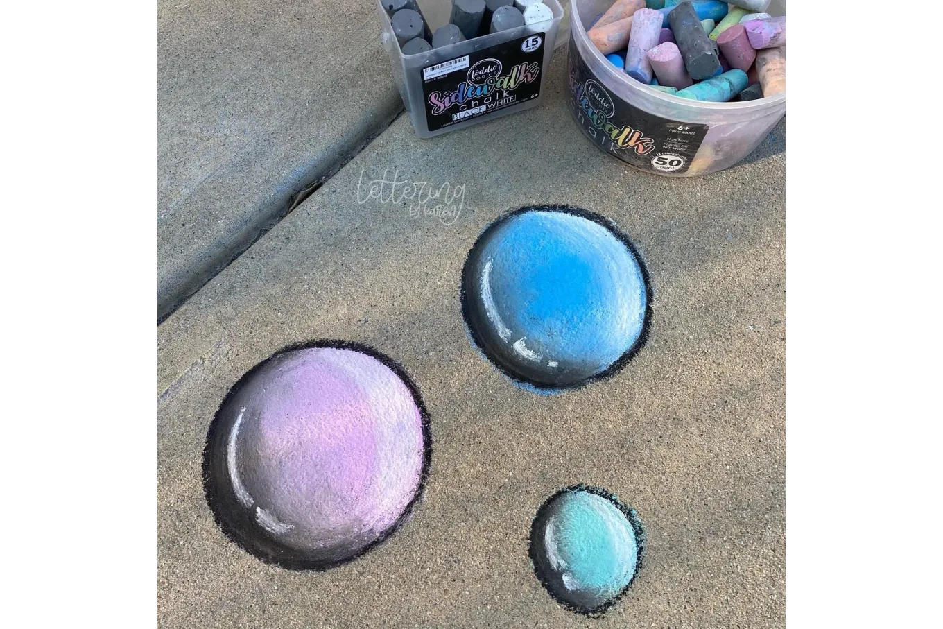 Chalk art of purple, blue, and green bubbles with black outlines