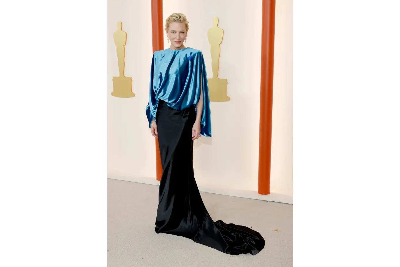 Cate Blanchett in a blue top with a long black skirt