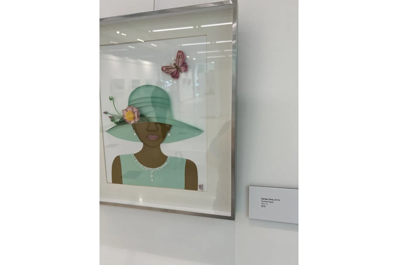 Quilled image of woman wearing hat