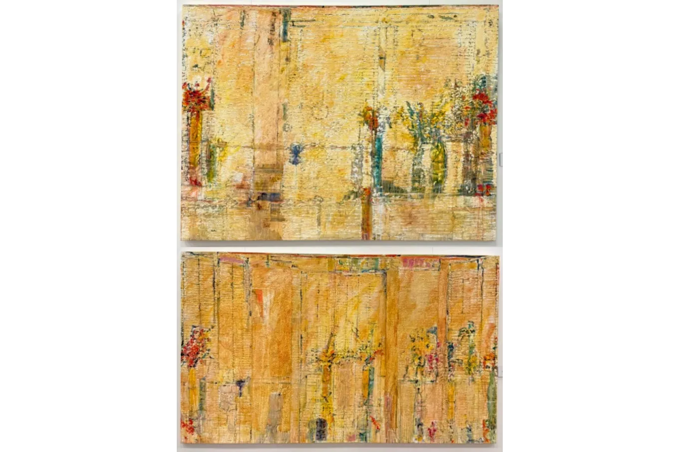 These two large abstract paintings feature heavily textured surfaces dominated by warm golden and ochre tones layered with vertical striations and subtle drips. Faint suggestions of flowers and vase-like forms emerge from the dense, scraped paint, with touches of red, green, and blue adding contrast. The thick impasto and rhythmic vertical lines create a sense of depth and movement, blending abstraction with hints of still-life imagery.