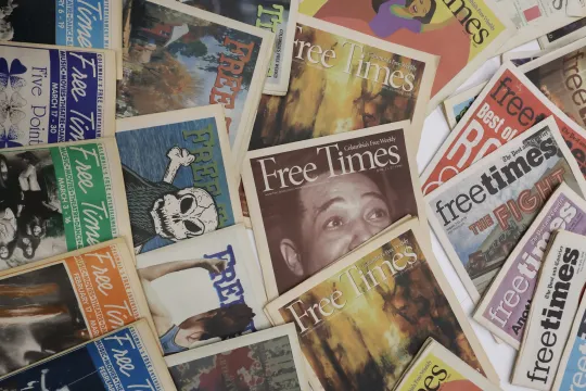 Multiple issues of Free Times newspapers arranged in a collage, showing a variety of cover designs, headlines, and artwork from different years.