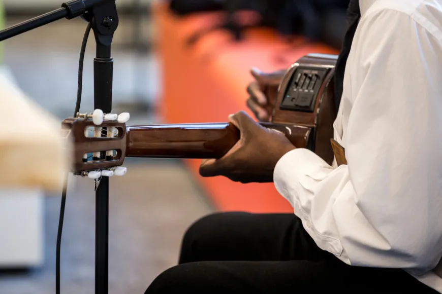 Man playing a guitar.
