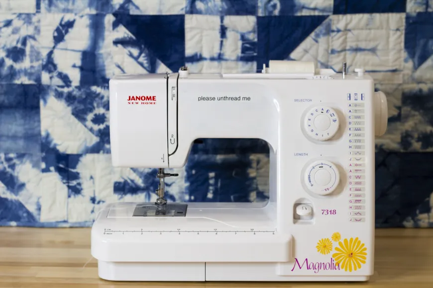 Sewing machine in front of quilt