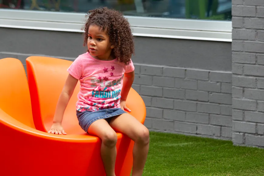 Little girls enjoys the courtyard at Richland Library Southeast