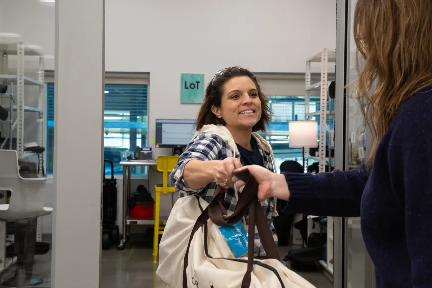 Staff hands customer library of things item