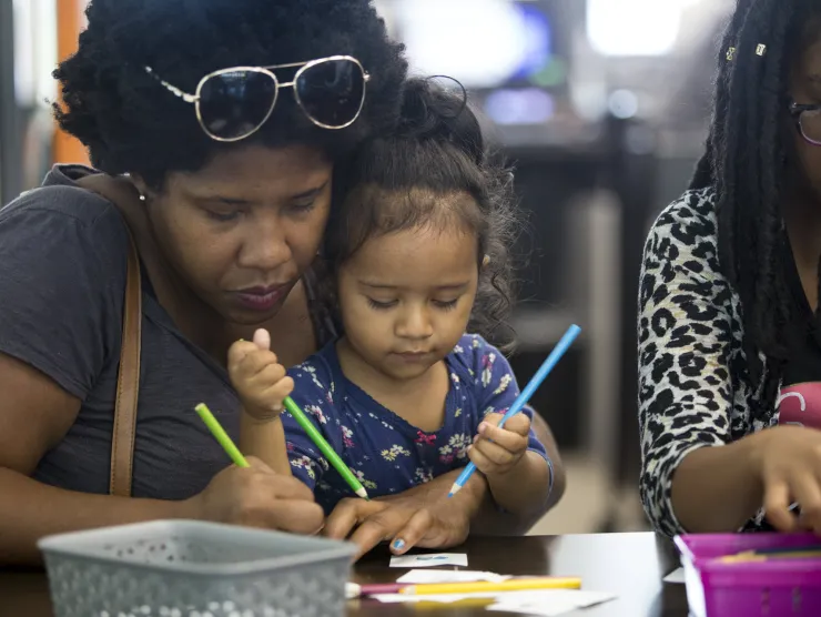 african american mom and child painting