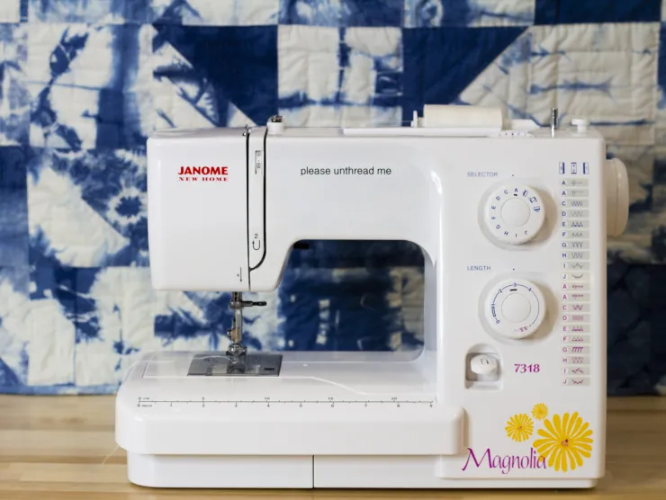 Sewing machine in front of quilt
