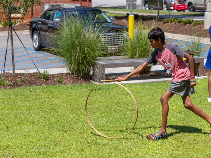 teen on the Hampton Street Plaza with a hoola hoop