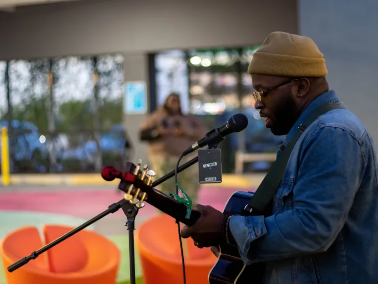 Customer performs during Open Mic at Richland Library Northeast
