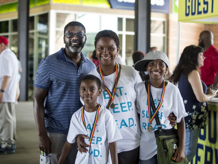 Family attends Columbia Fireflies baseball game after completing Summer Learning Challenge