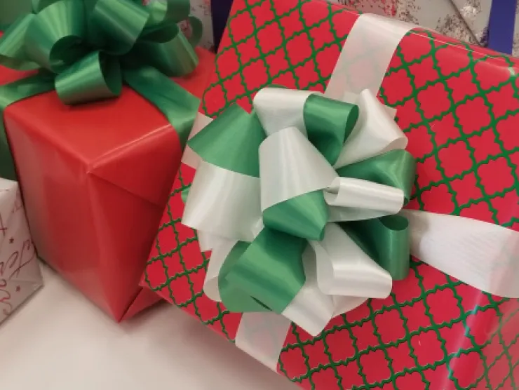 wrapped presents with fluffy bows