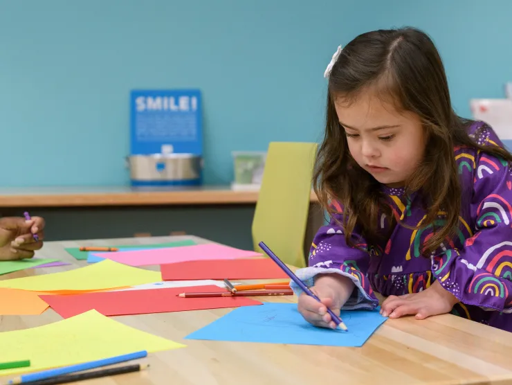 Preschool child participates in arts and crafts