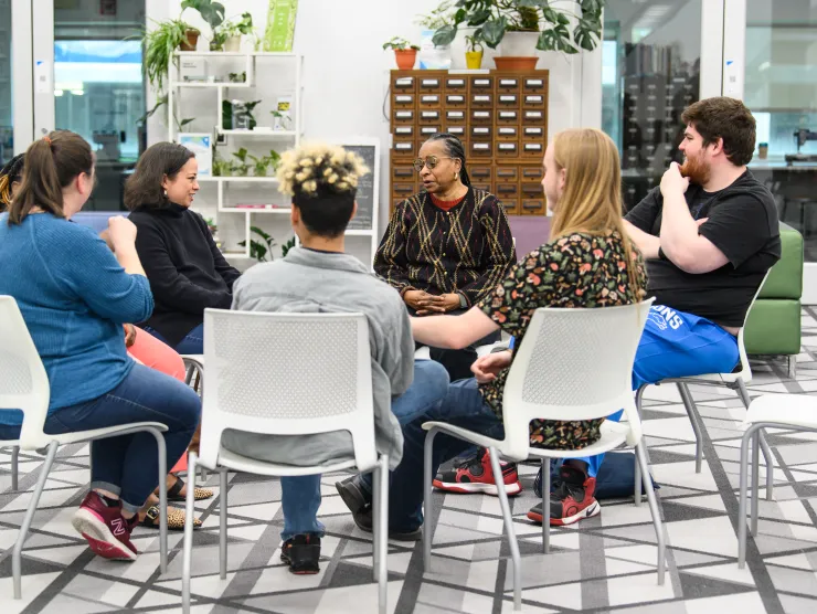 Circle of adults conversating 