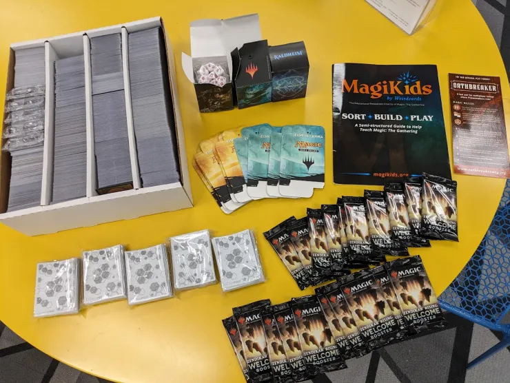 Various Magic The Gathering cards and accessories