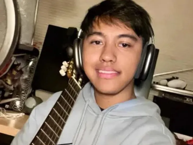 picture of Ethan holding guitar