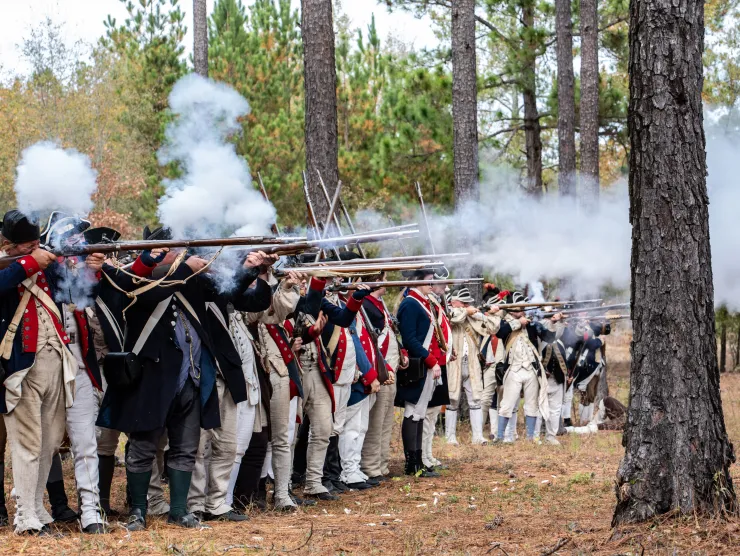 Reenactors shooting guns