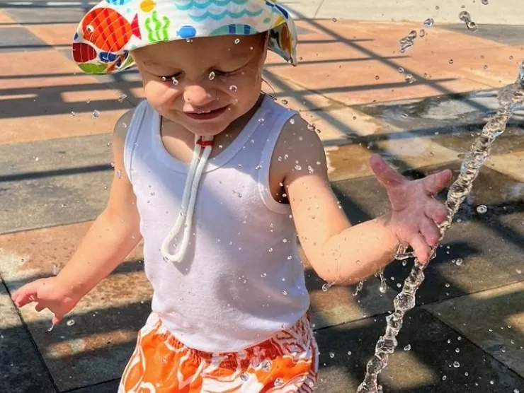 Child having fun at the splash pad.