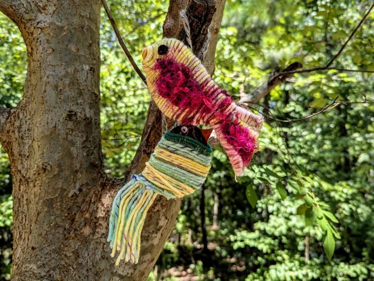 Two birds - they have cardboard bases and they're wrapped with different colors of yarn