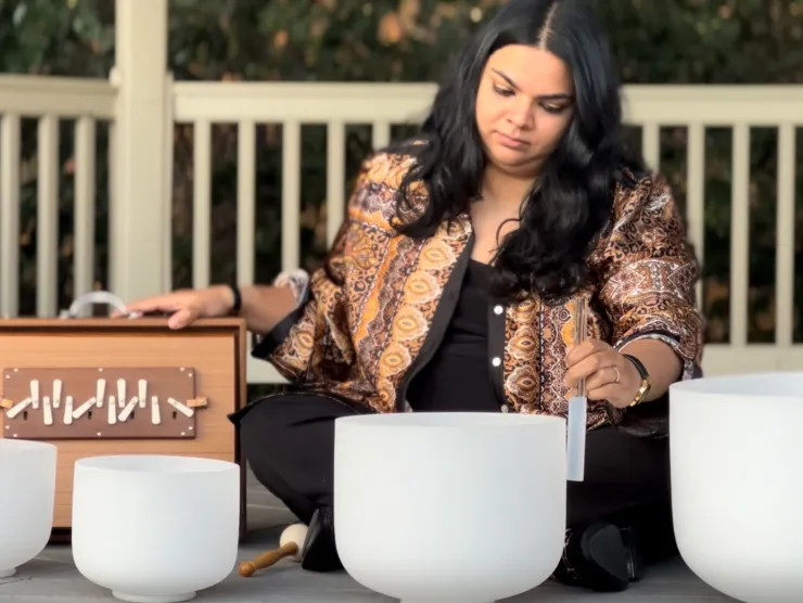 picture of Sudha McFadden manipulating sound bowls