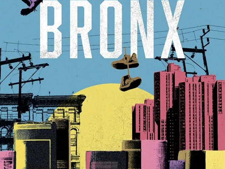 Cover of Bibliotherapy in The Bronx.  Light blue background reveals the Bronx skyline.  Yellow and pink buildings in the background transform to books in the foreground.  Phone lines and poles stretch across the cover with a pair of sneakers hanging on them.  Birds fly across the sky.  The title appears in white lettering.  