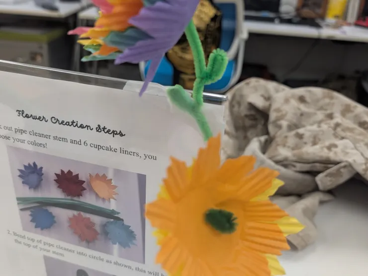 Flowers made out of cupcake holders and pipe cleaners.